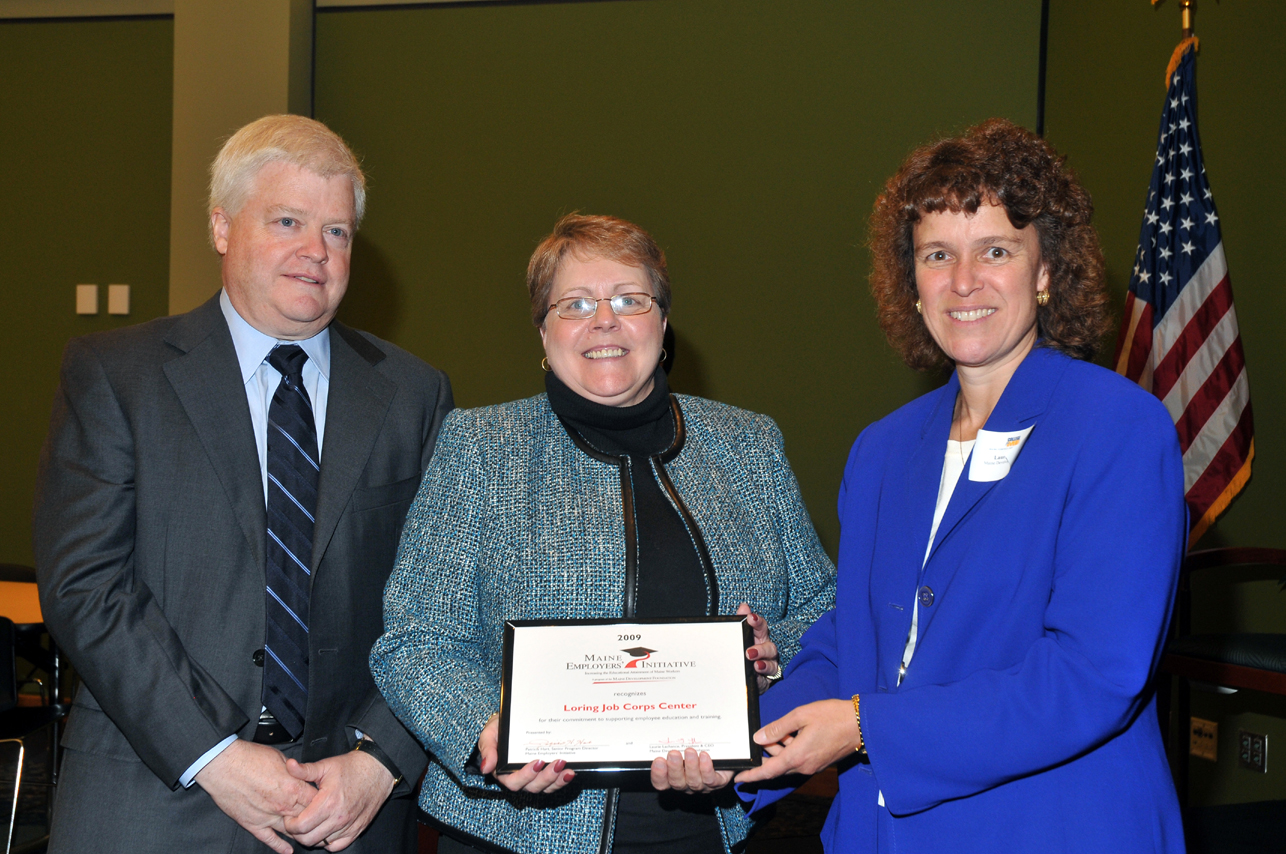 Dr. Dottie Martin accepts award from Maine Compact=